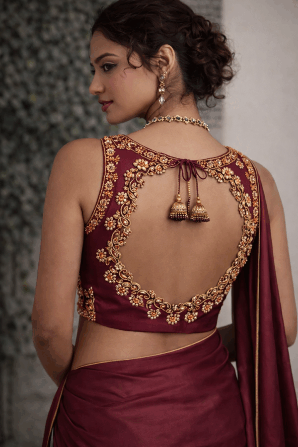 Sleeveless Maroon Silk Aari Work Blouse