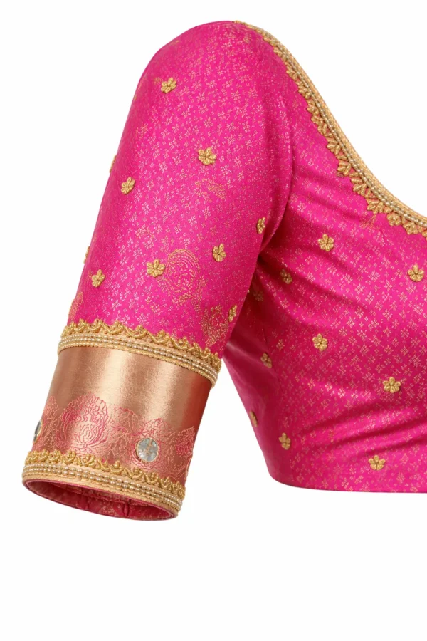 Aari work blouse sleeve design with zari border and bead work on pink silk bridal blouse