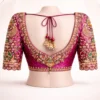 Deep back neck bridal blouse with heavy Aari embroidery and tassels