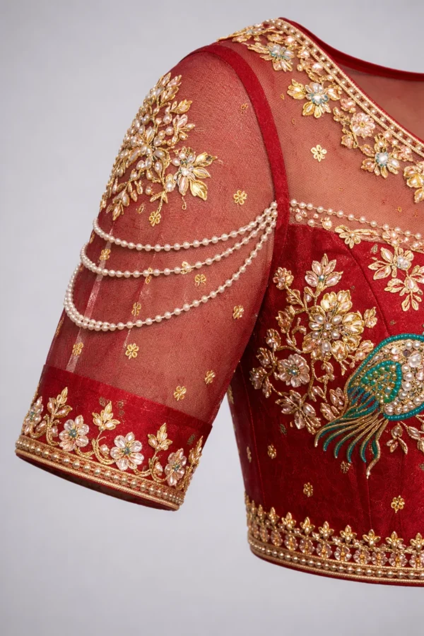 Aari work blouse sleeve design with pearl chain detailing