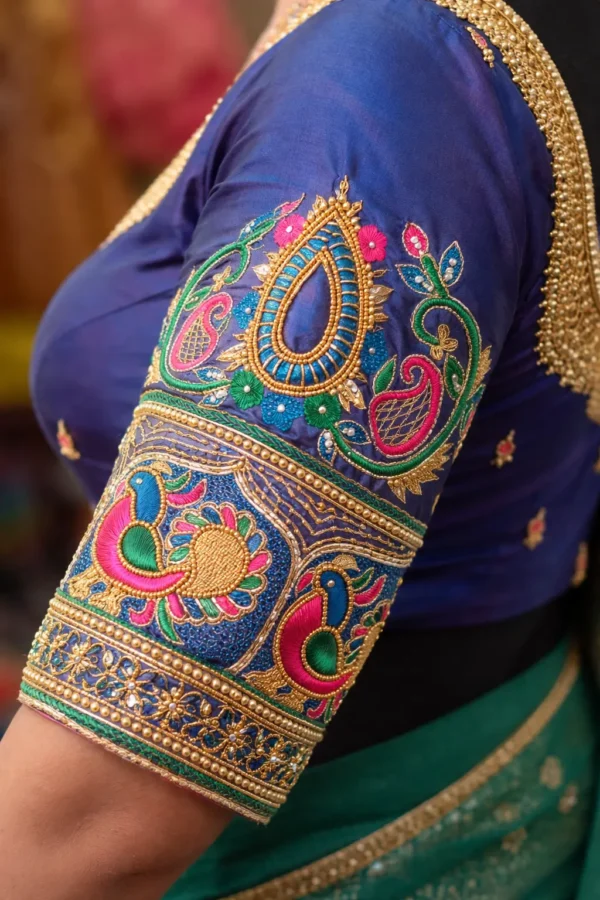 Aari blouse sleeve design peacock and paisley embroidery detail