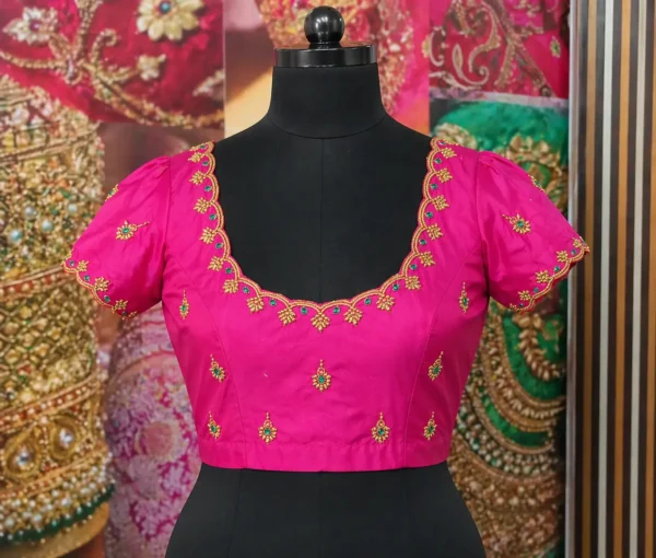 Pink bridal Aari work blouse front view with scalloped neckline