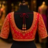 Deep back neck bridal Aari blouse with zari embroidery and tassels