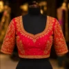 Luxury red bridal Aari embroidery blouse front view with heavy maggam work