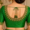 Back view of green bridal blouse with premium Aari embroidery and tassel detailing