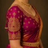 Temple motif bridal blouse sleeve featuring handcrafted Aari embroidery