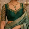 Luxury bridal Aari blouse front view with floral embroidery and designer net sleeves