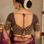 Deep V back Bridal Aari Blouse featuring geometric embroidery and hanging tassel detailing