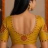 Kerala bridal Aari blouse back neck design with floral kolam embroidery and premium maggam work