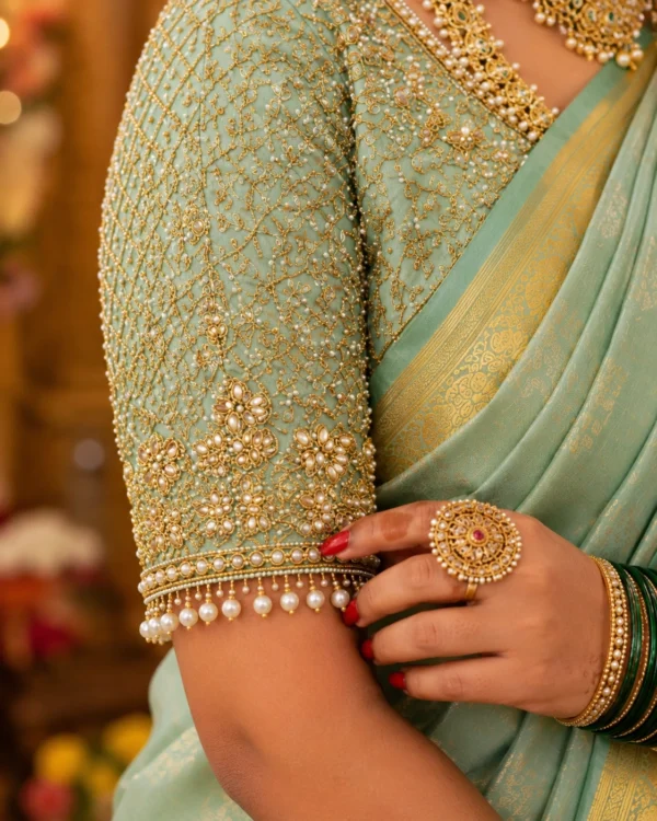 Heavy Aari Embroidery sleeve design with pearl border and floral vine work