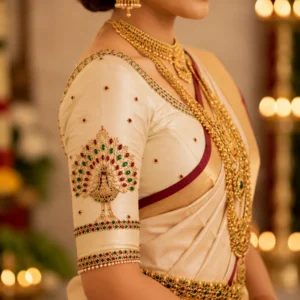 Peacock Sleeve Aari Embroidery Detail on Kerala Bridal Blouse with Premium Stone Work