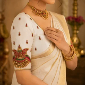Traditional Kerala blouse sleeve design featuring temple motif Aari embroidery and stone work
