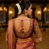 Back view of luxury Bridal Peacock Aari Work Blouse featuring deep U-neck, mirror work, handcrafted Maggam embroidery and peacock motif.