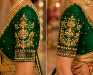 Close-up sleeve of Emerald Green Bridal Aari Blouse showcasing intricate floral embroidery, kundan work, pearl borders, and heavy Maggam craftsmanship.