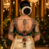 Deep U Back Emerald Green Bridal Aari Blouse with Floral Maggam Work, Tassels and Transparent Sleeves