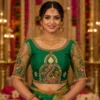 Emerald Green Peacock Aari Bridal Blouse front view featuring temple-inspired Maggam Work, zari embroidery, and traditional bridal craftsmanship.