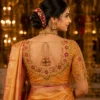 Golden Temple Heritage Bridal Aari Blouse Back View featuring deep U-neck, temple-inspired floral border, antique coin detailing and handcrafted Aari embroidery.