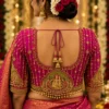 Magenta Bridal Aari Blouse back view with temple motif, gold Aari embroidery and dori latkan