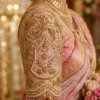 Pink gold Aari blouse sleeve detail with floral embroidery pearl beads and antique gold Maggam work
