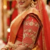 Red bridal Aari blouse sleeve with floral embroidery lattice beads and Maggam work