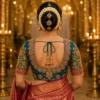 Deep U-back Royal Peacock Emerald Bridal Aari Blouse with intricate Maggam embroidery, emerald stone border, tassels, and premium bridal silk.